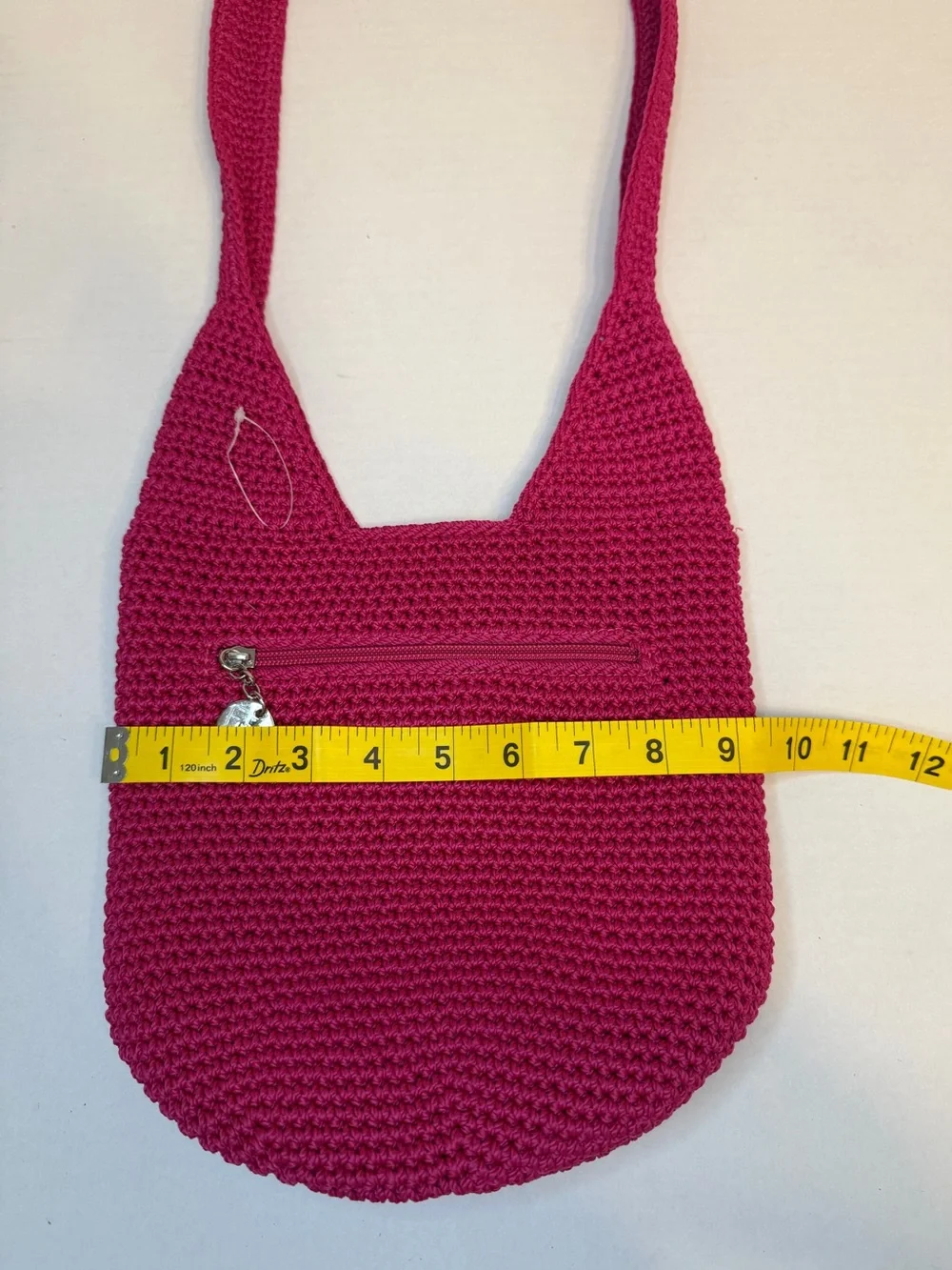 The Sak raspberry, pink handcrafted crochet hobo shoulder bag